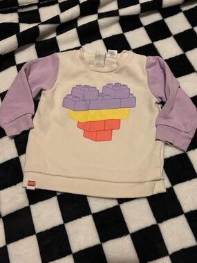 6/9 month girls Lego sweater (small pink stain)